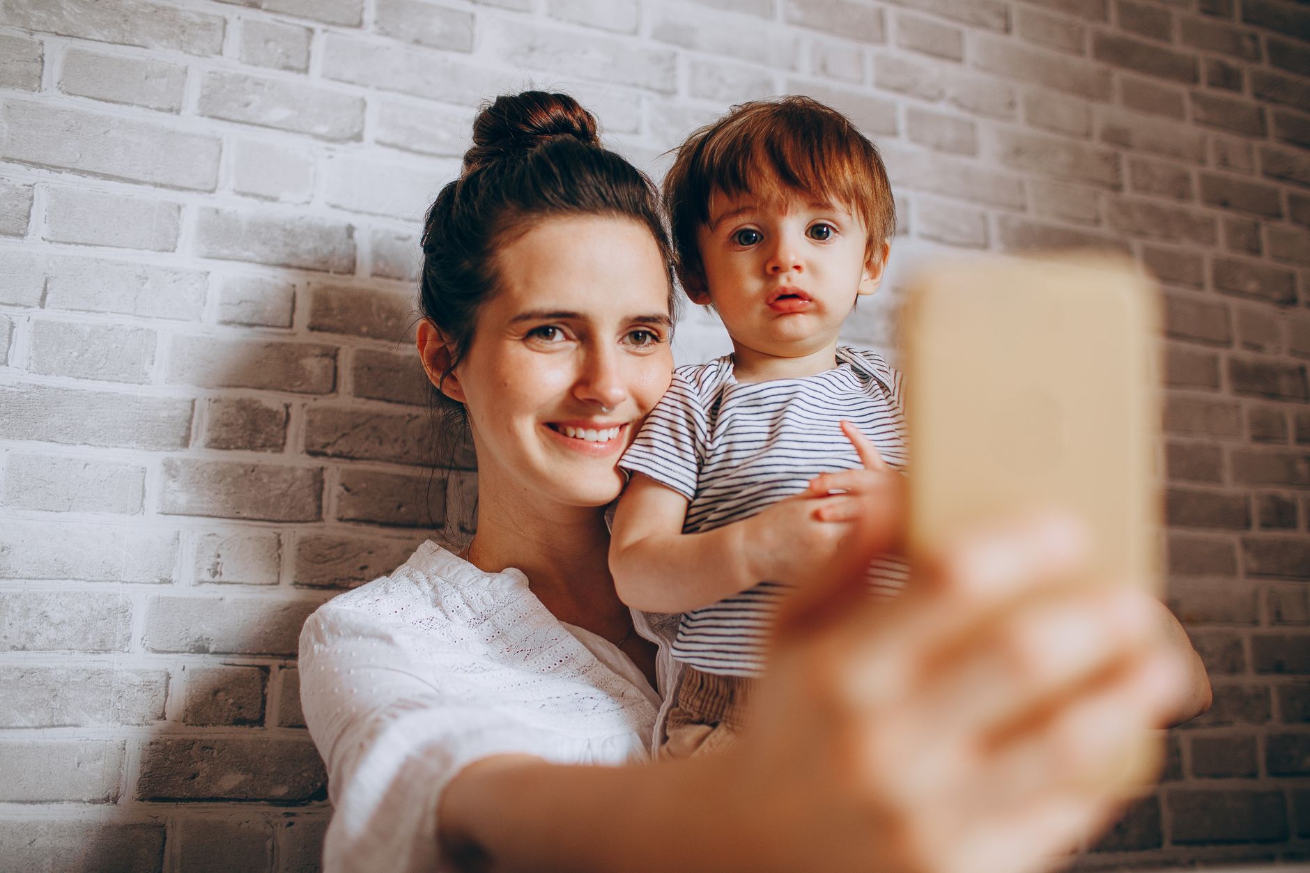 Mom creator sharing on her phone